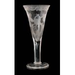 A 19th Century oversize drinking glass in the 18th Century taste with a drawn trumpet bowl above a