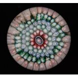 An early 20th Century Old English paperweight with a five row concentric millefiori cane work