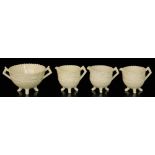 A late 19th Century Queens Ivory pressed glass twin handled sugar bowl on four swept feet to the
