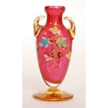 A late 19th Century Moser vase of compressed ovoid form with collar neck and applied scroll handles,