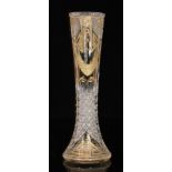 An early 20th Century continental clear crystal glass vase of waisted sleeve form with flared foot,