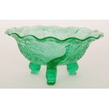 A late 19th Century Sowerby translucent green pressed glass flared bowl raised above three fish
