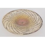 A contemporary Allister Malcolm Mermaid Range footed dish with net of deep cinnamon profusely