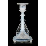 A late 19th Century Sowerby opalescent pressed glass candlestick the circular base on three short