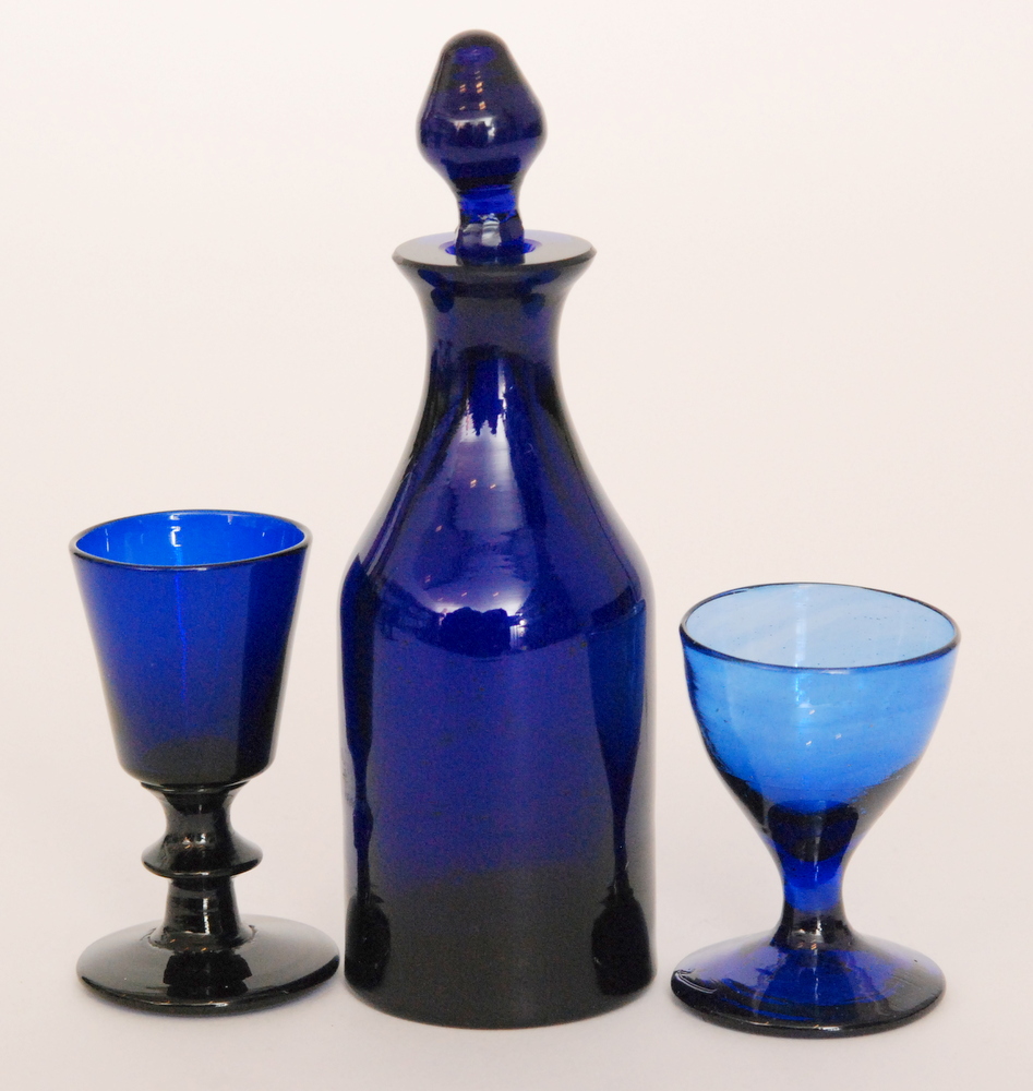 A late Georgian miniature Bristol blue decanter of shouldered ovoid form with collar neck and spire