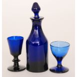 A late Georgian miniature Bristol blue decanter of shouldered ovoid form with collar neck and spire