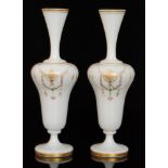 A pair of late 19th Century continental vases the spread foot to an inverted baluster body to a