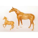 Two Beswick horses comprising a Palomino (prancing Arab type) model 1261, first version,