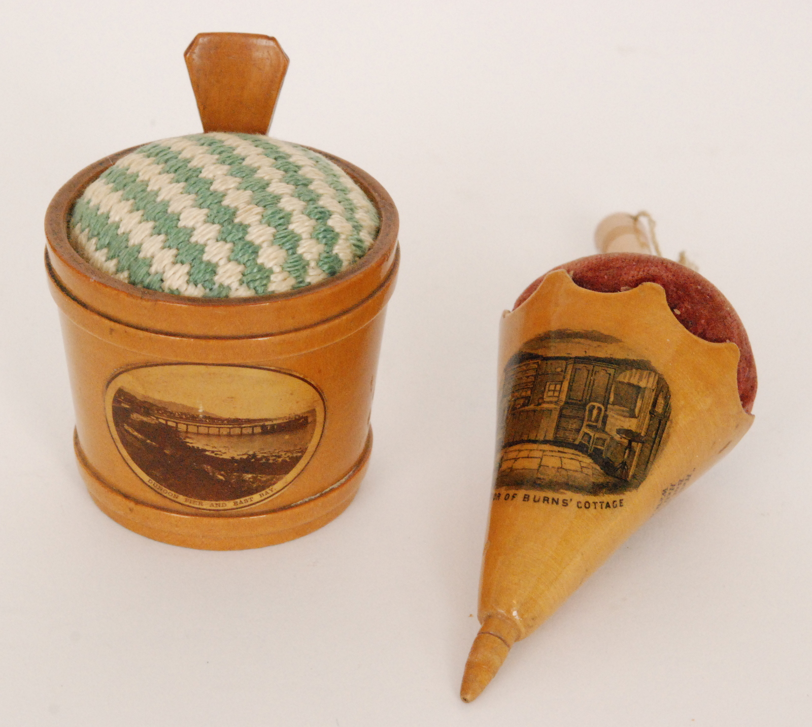 Two 19th Century Mauchline Ware pin cushions,