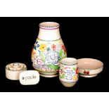 Five pieces of assorted Poole Pottery comprising a BN pattern shape 337 vase, a silent salesman,