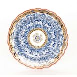 A late 18th to early 19th Century Worcester Royal Lily pattern fluted edge plate with panels of