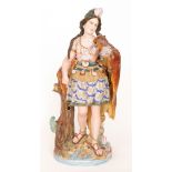 A large early 20th Century continental bisque figure modelled as Pocahontas stood on a river bank,
