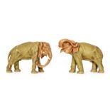 A pair of Czechoslovakian elephants in the style of Royal Dux,