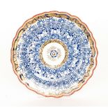 A late 18th to early 19th Century Worcester Royal Lily pattern fluted edge plate with panels of