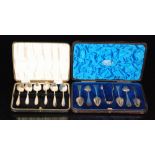 A cased set of six hallmarked silver rat tailed pattern teaspoons and tongs with a similar set,