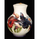 A Moorcroft Frilled Orchid pattern table lamp decorated with tube lined flowers and foliage against