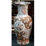 A large later 20th Century Chinese floor vase decorated with floral panels against a patterned
