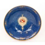 A large Royal Worcester footed bowl decorated with a small Fallen Fruits roundel to the central