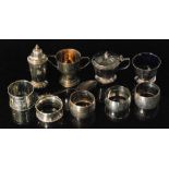 A cased hallmarked silver three piece cruet set of plain faceted form, Chester 1930,