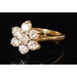 A modern 18ct hallmarked diamond cluster ring,