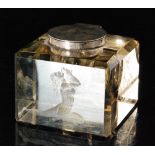 A hallmarked silver and clear cut glass square sectioned ink well decorated with a stipple engraved