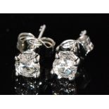 A pair of 18ct white gold diamond stud earrings, each measuring approximately 0.