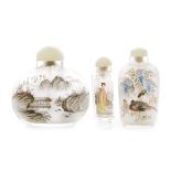 A group of three early 20th Century Chinese glass snuff bottles to include a compressed ovoid