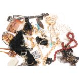 A parcel lot of assorted costume jewellery to include Trifari bracelet, beads, hat pins,