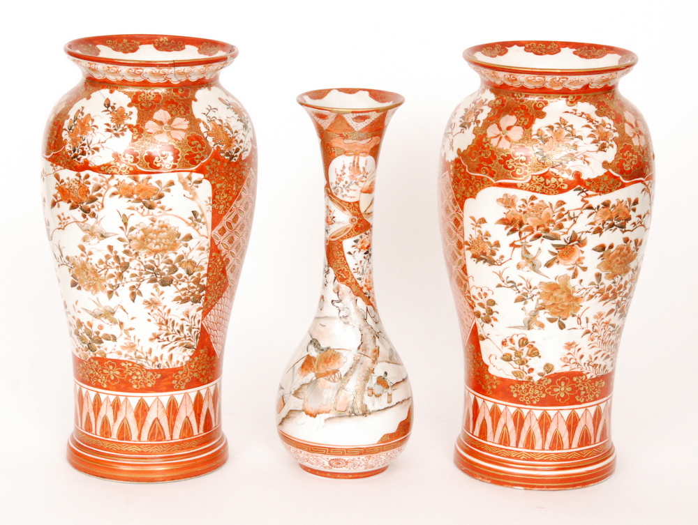 A pair of late 19th Century Japanese Kutani vases each decorated with panels of birds and foliage