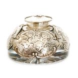 An Edwardian hallmarked silver and clear cut glass domed shaped ink well decorated with four panels