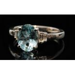 A modern 18ct white gold aquamarine and diamond ring,