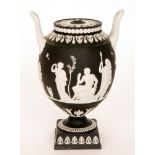 A contemporary Wedgwood Genius Collection twin handled black basalt jasper ware pedestal vase