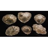 Six late 19th to early 20th Century hallmarked silver pierced and embossed bon bon dishes,