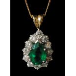 An 18ct emerald and diamond pendant,