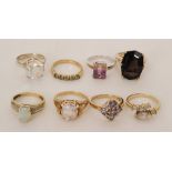 Six 9ct stone set dress rings to include tanzanite, ametrine, opal and diamond, smoky quartz, etc.