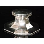 A hallmarked silver ink well of plain octagonal form terminating in plain hinged cover, diameter 13.