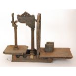 A set of early 20th Century wrought iron weighing scales, width 59cm, together with a 7lb weight.