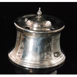 A hallmarked silver drum shaped ink well of plain form with central dome hinged cover with three