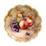 A Royal Worcester Fallen Fruits cabinet plate decorated by H Price with hand painted peaches,