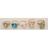 A group of five 9ct stone set rings to include blue zircon, pearl, opal and quartz examples,