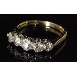 A hallmarked 18ct five stone diamond ring,