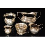 Five items of assorted hallmarked silver to include a sugar basin, a fern pot,