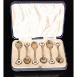 A cased set of six hallmarked silver teaspoons each with enamelled Tudor rose to terminal,