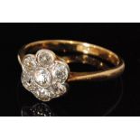 An early 20th Century 18ct diamond daisy cluster ring,