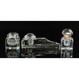 An Art Deco clear cut glass rectangular ink well with three pen rests and faceted glass cover,