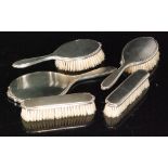 A 1960s hallmarked silver six piece dressing table set composed of four brushes,