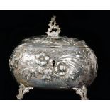 An Austrian silver embossed tea caddy of oval form with hinged lid,