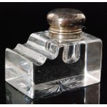 An early 20th Century silver plated and clear cut glass rectangular ink well,