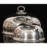 A graduated set of three silver plated oval meat covers of plain form,