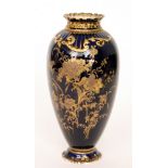 A late 19th Century Royal Crown Derby vase decorated with gilt flowers and foliage over a dark blue